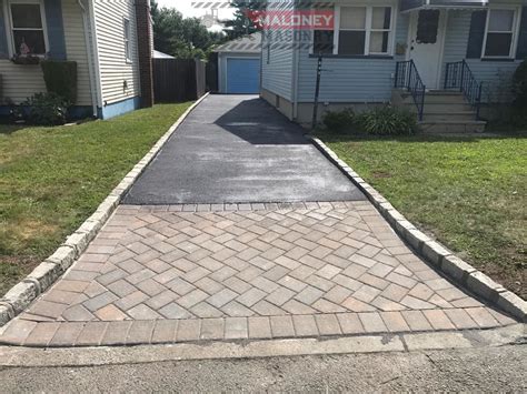 Asphalt Driveway With Paver Border