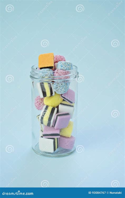 A Small Glass Jar Filled With Colored Candy Stock Image Image Of Glass Lactose 93084767