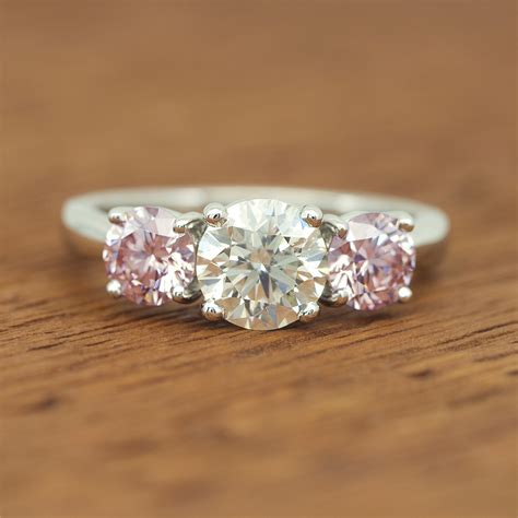 Pink Diamond and White Diamond 3 Stone Platinum Ring (wow!)