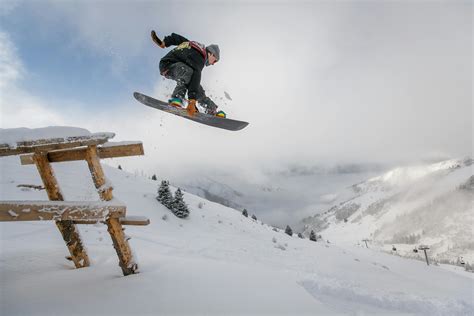 Man In Black Snowboard With Binding Performs A Jump · Free Stock Photo