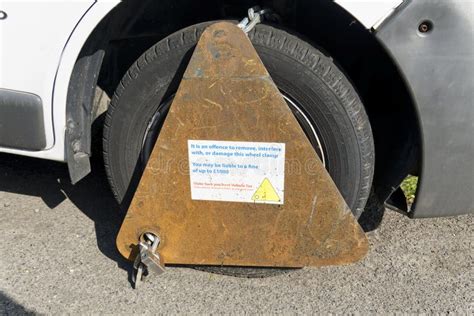 A Wheel Clamp On An Untaxed Vehicle Editorial Image Image Of Clamping