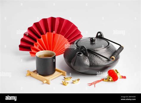 Teapot, cup of tea and Chinese symbols on white background Stock Photo ...