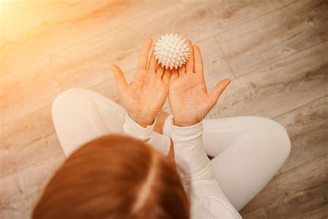 Athletic Slim Caucasian Woman Doing Thigh Self Massage With A Massage