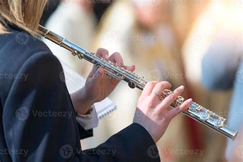 Transverse flute plays in the band 11971880 Stock Photo at Vecteezy