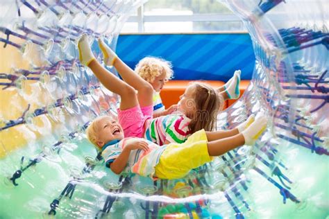 Child Play In Roller Wheel Kids On Trampoline Stock Photo Image Of