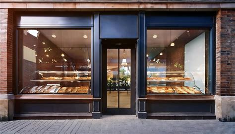 charming bakery storefront  glass windows showcasing delightful