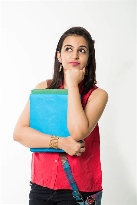 Premium Photo Pretty Indian Or Asian Young College Girl Holding Books