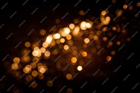 Premium Photo | Gold abstract bokeh on black background