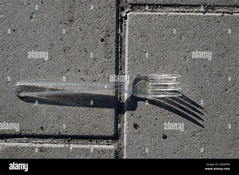 clear plastic fork  ground stock photo alamy