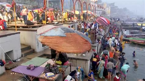 Devotees Take Holy Dip In River Ganga In Ups Varanasi On Occasion Of