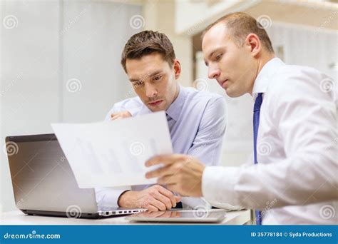 Two Businessmen Having Discussion In Office Stock Photo Image Of