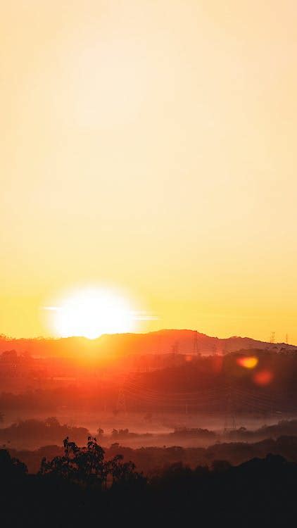 Clear Sky at Sunset and Silhouette of Hills · Free Stock Photo