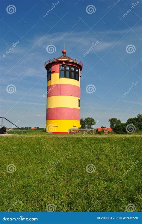 Pilsum Lighthouse In Pink Sunset Stock Image | CartoonDealer.com #194219125