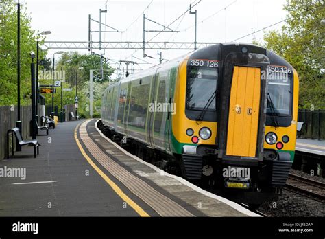 London Midland class 350 electric train at Long Buckby station ...