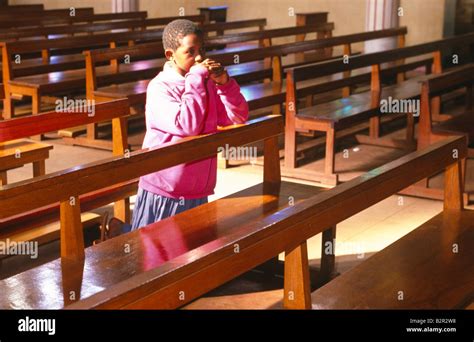 Young Boy Praying In A Church In Africa Stock Photo Alamy