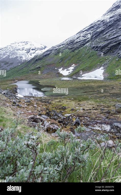 Hiking in the beautiful area of Trollstigen mountain pass in Norway ...