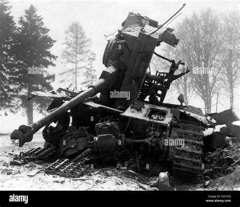 The Wreckage Of A German Tank Destroyed Near Bastogne During The