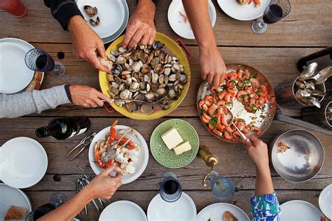 Hands Serving Shellfish Meal Around By Lisa Romerein