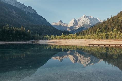 Premium Photo Morning Reflections Of The Mountains Forest And Hills