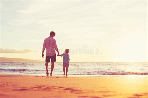 Father And Son Walking Together Holding Hands Stock Photo Image Of