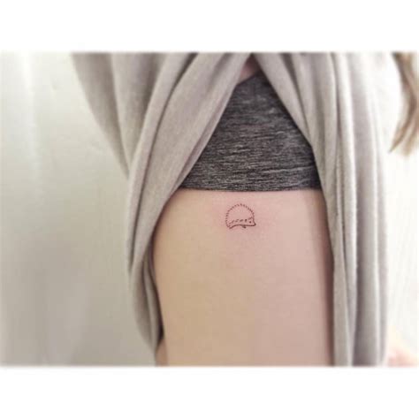 Minimalistic Style Hedgehog Tattoo Located On The Rib