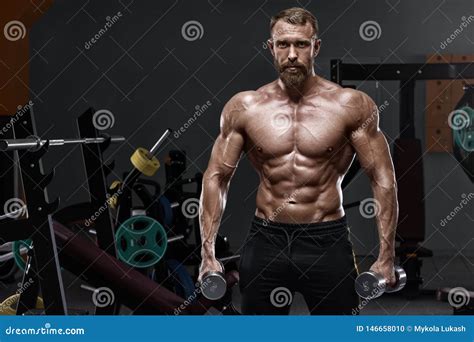 Muscular Man In Gym With Dumbbells Strong Male Naked Torso Abs