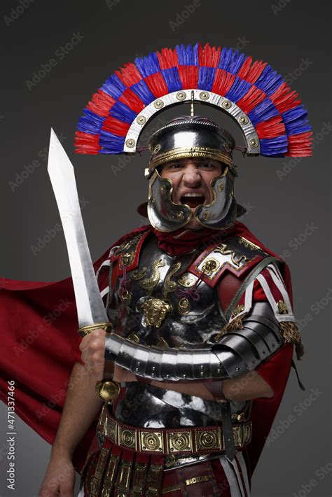 Screaming Roman Centurion With Red Cloak Holding Gladius Stock Photo