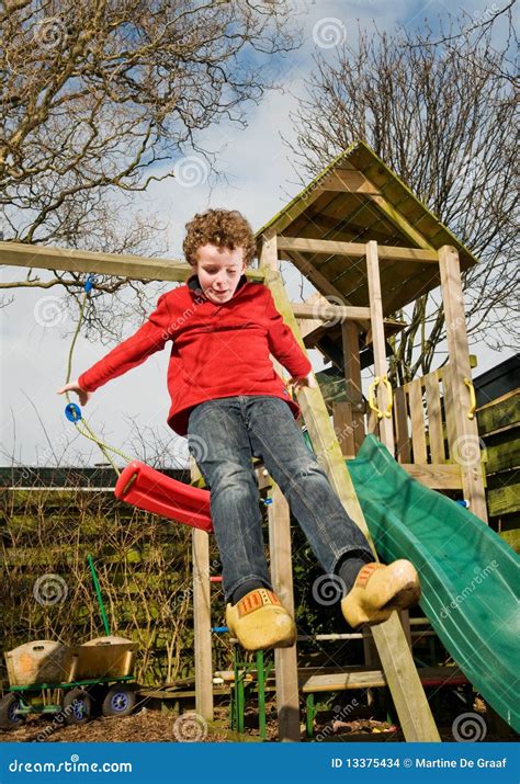 Kid jumping from swing stock photo. Image of slide, huge - 13375434