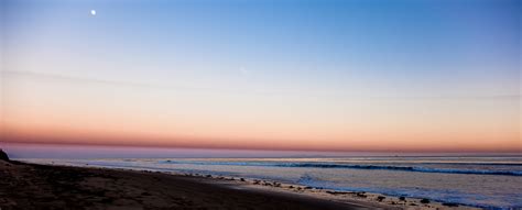 moon rise at sunset on beach - long - Church of God