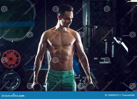 Strong Muscular Man With Naked Torso Abs Working Out In Gym Doing