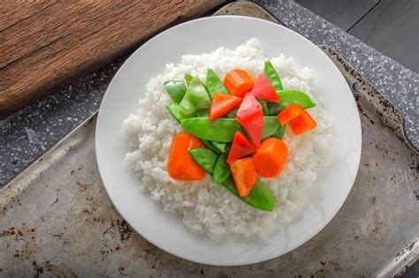 premium photo gourmet delight closeup  steamed rice  cooked