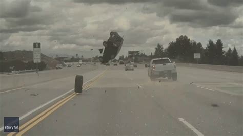 Car Goes Airborne On Los Angeles Freeway After Tire Pops Off Pickup