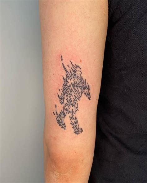 Hand Poked Man On Fire Tattoo Located On The Tricep