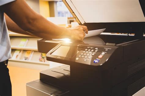 Premium Photo | Photocopier printer Close up hand office man scanning ...