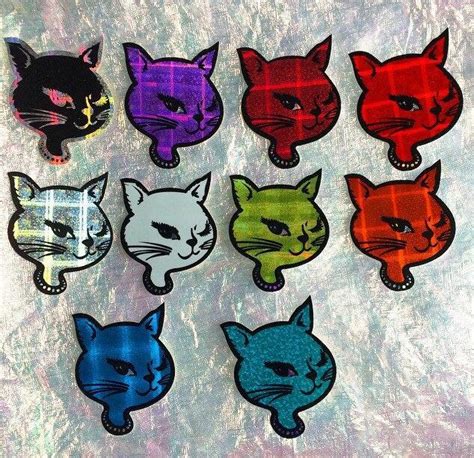 These winking kitty stickers out of the coin machines at the skating ...