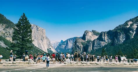 people standing   mountains  blue sky  stock photo