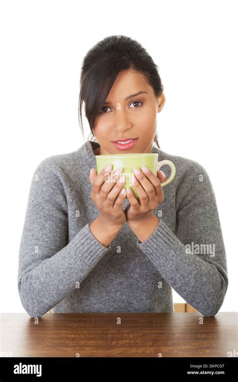 Young Woman Drinking Something From Big Mug Isolated On White Stock