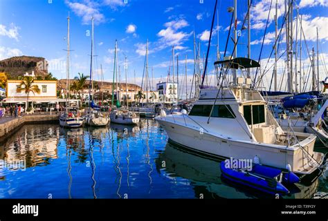 Beautiful Puerto De Mogan Villageview With Boats And Housesgran