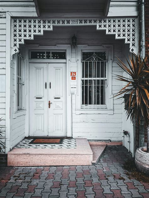 White Door and Window in Entrance to MansionFree Stock Photo