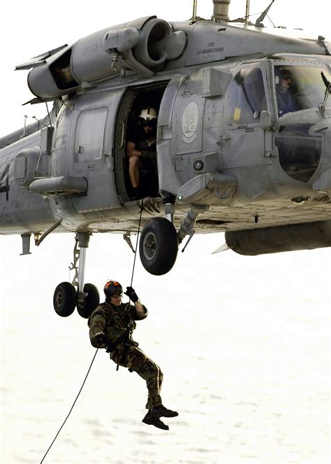 A US Navy USN Sailor Assigned To Explosive Ordnance Disposal Unit 11