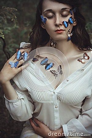 Beautiful Art Portrait Of A Naked Woman With Blue Butterflies On Stock