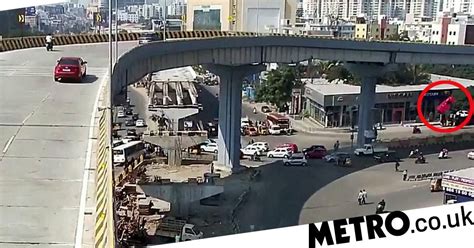 Woman Killed After Car Plummets Off Flyover Into Crowd Of People