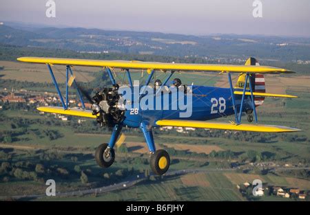 An Aerial View Of A Wwii Boeing Stearman Biplane Pilot Trainer In Black