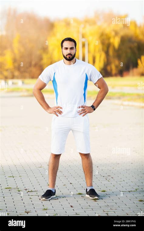 Fitness. Stretch man doing stretching exercise. Standing forward bend ...