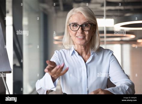 Mature Businesswoman Looking At Camera And Talking Making Video Call