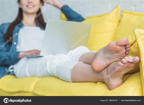 Cropped Shot Smiling Barefoot Girl Using Laptop Sofa Home Stock Photo ...