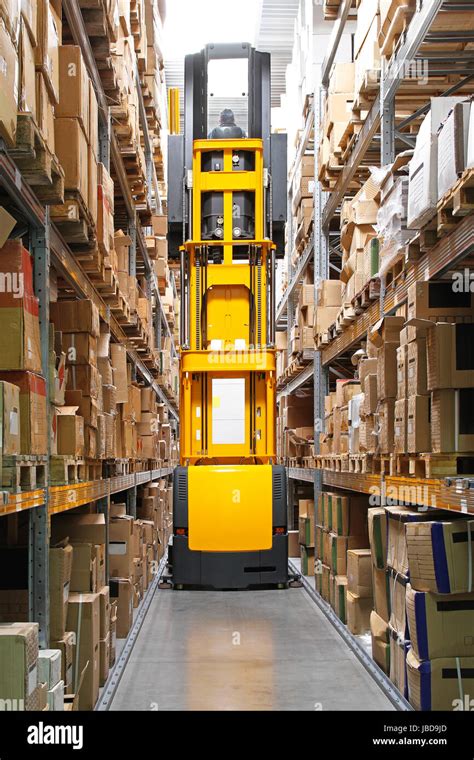 High Rack Stacker Forklift Truck In Warehouse Row Stock Photo Alamy