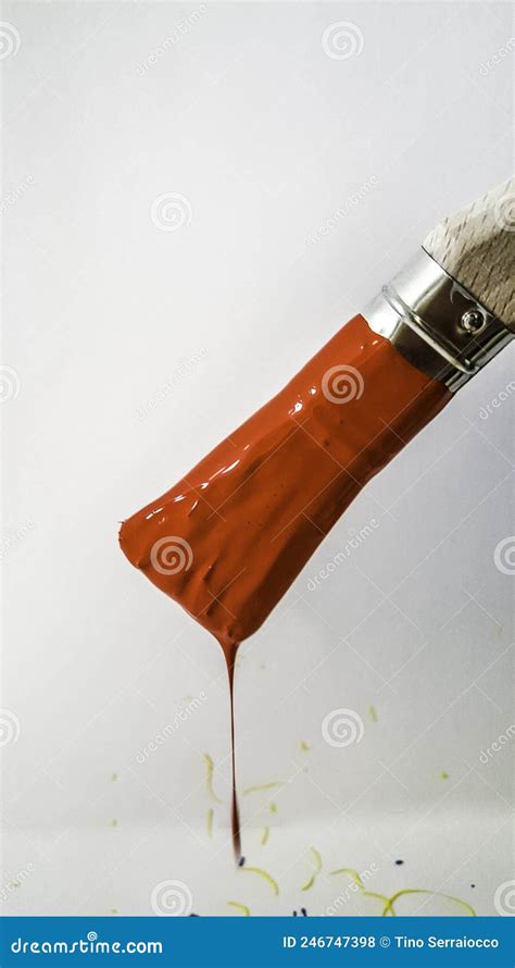 Paintbrush With Red Paint Dripping On White Background Stock Photo