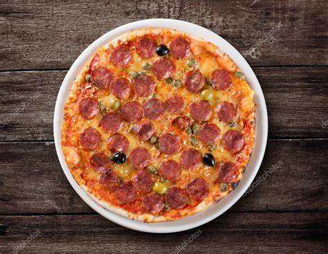 Italian Salami Pizza Top View On Wooden Table — Stock Photo © Andrey