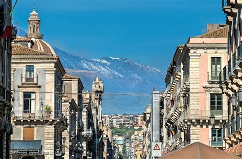 Premium Photo | View of the historic centre of catania with etna volcano in the background ...